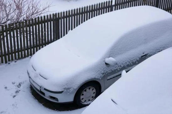 Car hard to start during cold winter conditions with snow, a common cold start issue in European climates Car hard to start during cold winter conditions with snow, a common cold start issue in European climates