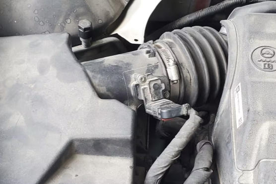 Engine light on car shaking during idle, illustrating diagnostic tools and OBD-II scanning