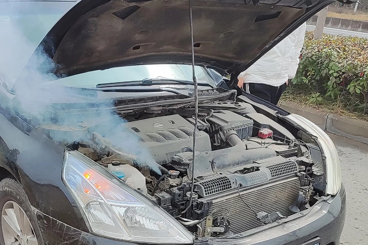 car engine overheating with smoke from engine bay caused by a bad water pump